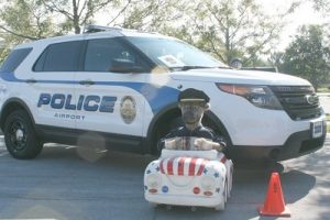 police cruiser with kid in a ride on car at kids and cops days westerville