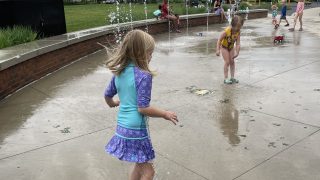 kids playing in splash pad summer bucket list